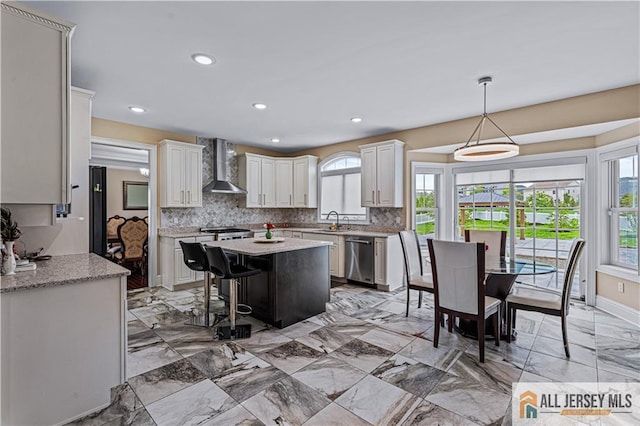 153 Scarborough Rd, Montgomery, NJ 08502 - kitchen featuring wall chimney range hood, stainless steel dishwasher, a sink, backsplash, and a kitchen island