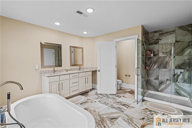 153 Scarborough Rd, Montgomery, NJ 08502 - full bathroom featuring a freestanding bath, double vanity, a stall shower, toilet, and recessed lighting