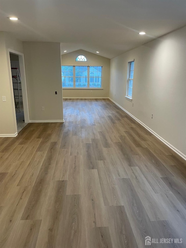 218 N Pondview Blvd, Monroe, NJ 08831 - empty room featuring wood finished floors, vaulted ceiling, and recessed lighting