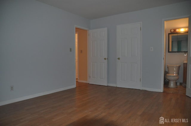 8 Delsey Rd, South Brunswick, NJ 08824 - unfurnished bedroom featuring wood finished floors, connected bathroom, and baseboards