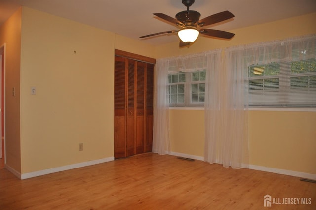 8 Delsey Rd, South Brunswick, NJ 08824 - spare room with wood finished floors, a ceiling fan, and baseboards