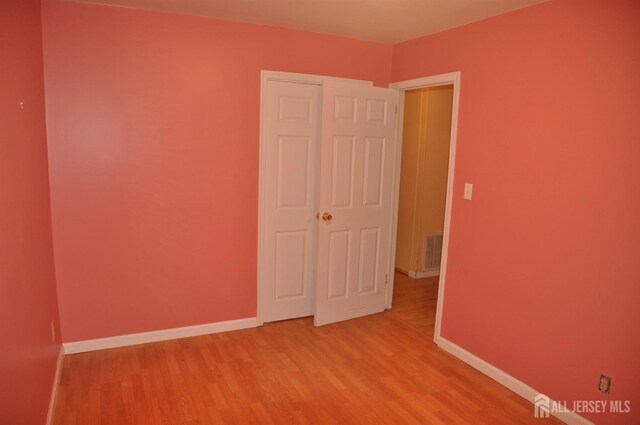 8 Delsey Rd, South Brunswick, NJ 08824 - unfurnished bedroom with light wood finished floors and baseboards