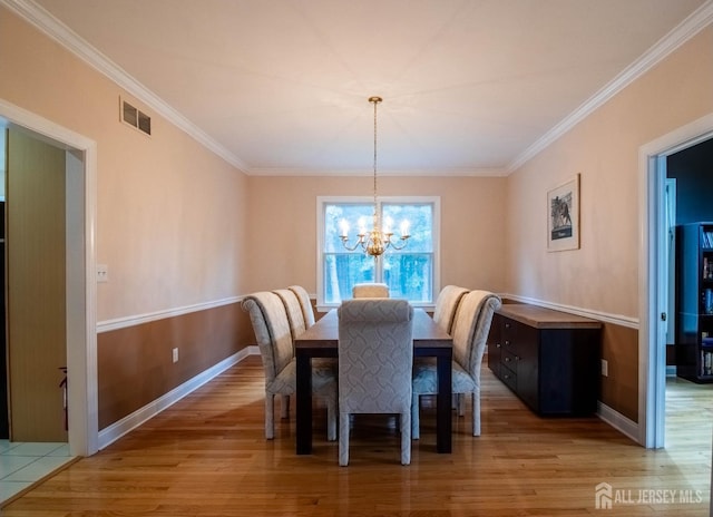 13 Carnegie St, Monroe, NJ 08831 - dining space featuring a chandelier, ornamental molding, and light wood finished floors