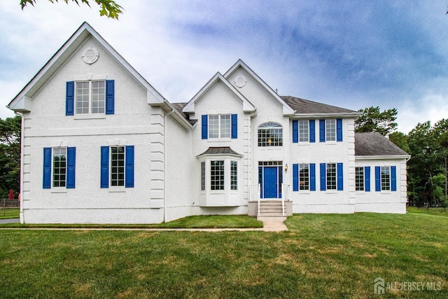 13 Carnegie St, Monroe, NJ 08831 - view of front of property with a front yard, entry steps, and a shingled roof