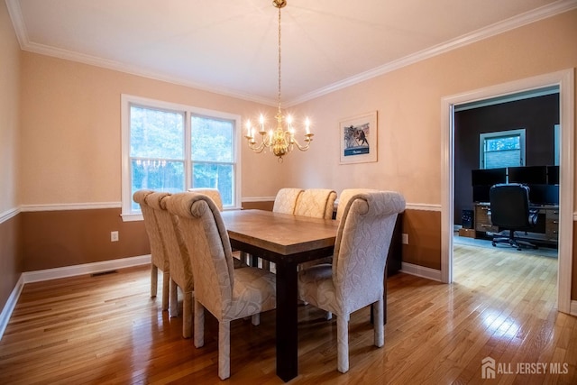 13 Carnegie St, Monroe, NJ 08831 - dining space featuring a chandelier, light wood finished floors, and crown molding