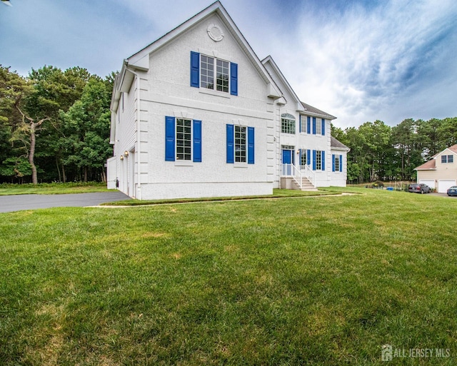 13 Carnegie St, Monroe, NJ 08831 - view of front of home with driveway and a front lawn