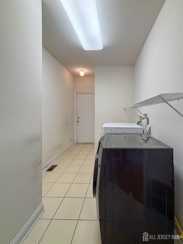 13 Carnegie St, Monroe, NJ 08831 - washroom with independent washer and dryer and light tile patterned floors