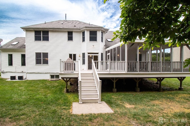 13 Carnegie St, Monroe, NJ 08831 - rear view of house with a sunroom, a deck, stairway, a yard, and a shingled roof