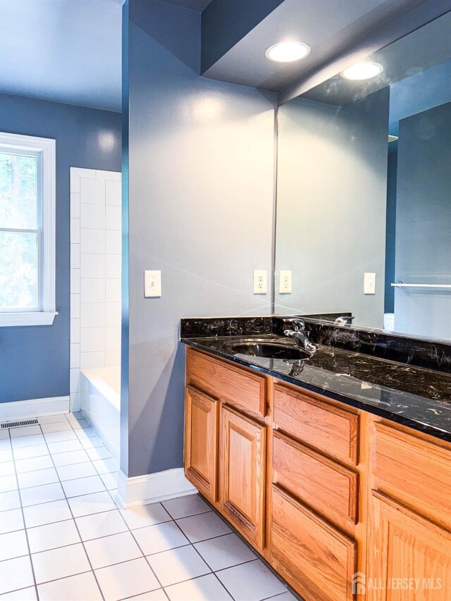 13 Carnegie St, Monroe, NJ 08831 - full bath featuring tile patterned flooring, vanity, and a tub to relax in