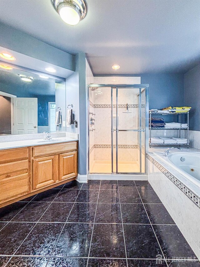 13 Carnegie St, Monroe, NJ 08831 - full bathroom featuring a jetted tub, a shower stall, vanity, and recessed lighting