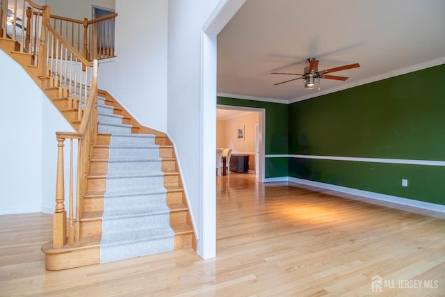 13 Carnegie St, Monroe, NJ 08831 - staircase featuring wood finished floors, a ceiling fan, and crown molding