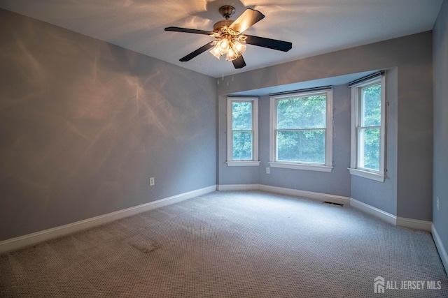 13 Carnegie St, Monroe, NJ 08831 - carpeted empty room featuring baseboards and a ceiling fan