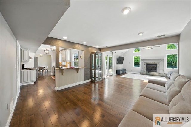 1072 Lake Placid Dr, Toms River, NJ 08753 - living room with ceiling fan, dark wood finished floors, recessed lighting, and a glass covered fireplace