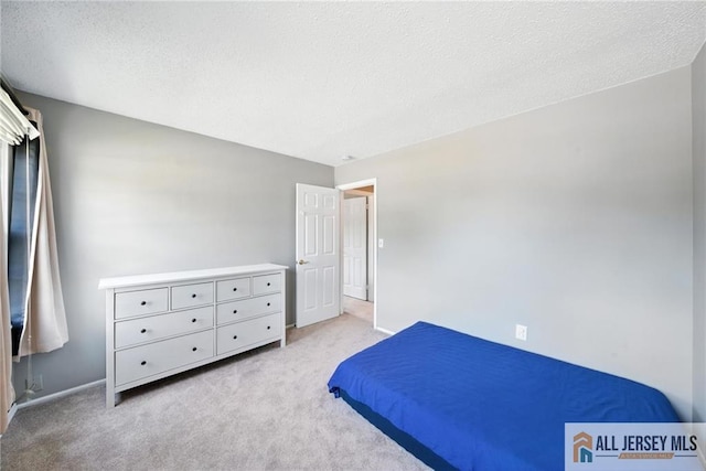 1072 Lake Placid Dr, Toms River, NJ 08753 - carpeted bedroom with a textured ceiling and baseboards