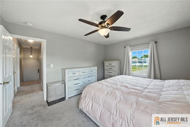 1072 Lake Placid Dr, Toms River, NJ 08753 - carpeted bedroom featuring attic access, a textured ceiling, and a ceiling fan
