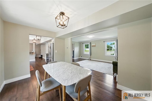 1072 Lake Placid Dr, Toms River, NJ 08753 - dining area featuring a chandelier and dark wood-style flooring