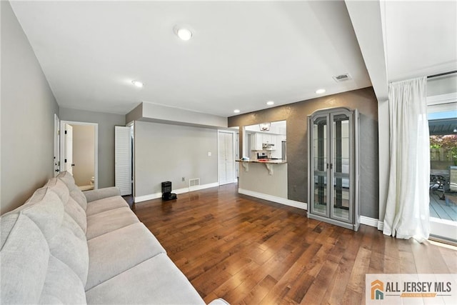 1072 Lake Placid Dr, Toms River, NJ 08753 - unfurnished living room featuring dark wood-style floors and recessed lighting