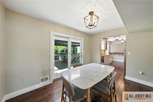 1072 Lake Placid Dr, Toms River, NJ 08753 - dining space with a chandelier and dark wood-type flooring
