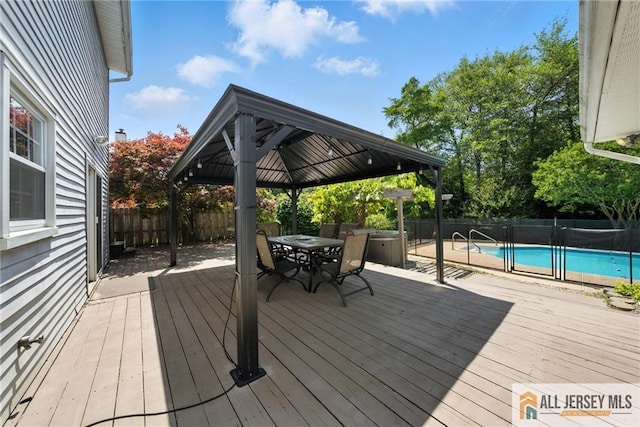 1072 Lake Placid Dr, Toms River, NJ 08753 - deck featuring a gazebo, a fenced backyard, and outdoor dining area