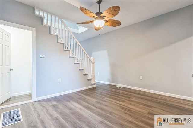 interior space with wood-type flooring and ceiling fan