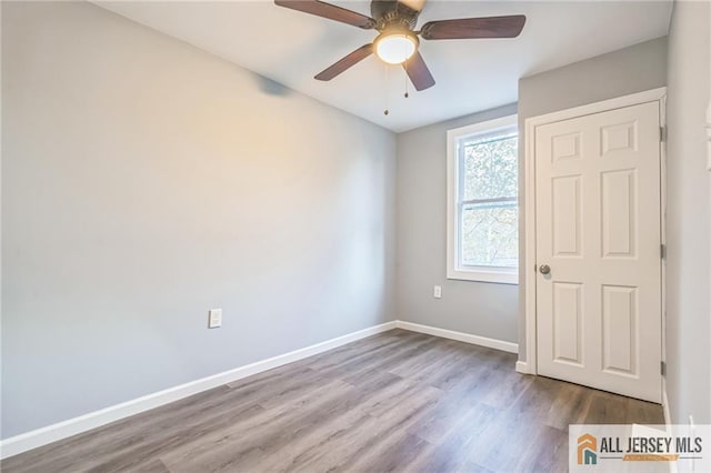 spare room with ceiling fan and light hardwood / wood-style floors