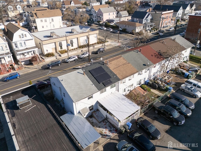 birds eye view of property with a residential view