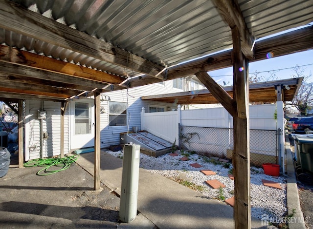view of patio featuring fence
