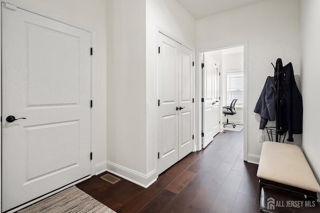 interior space with dark wood-type flooring