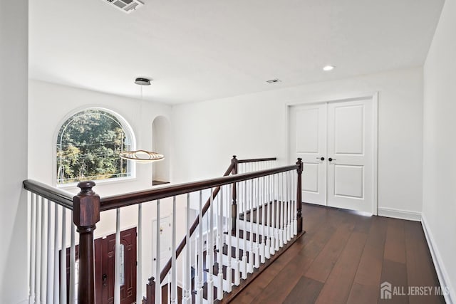 hallway featuring dark wood-type flooring