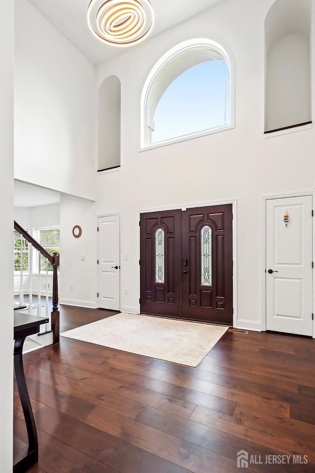 foyer with dark hardwood / wood-style flooring