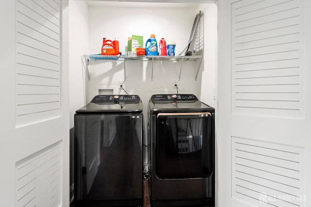 laundry room featuring separate washer and dryer