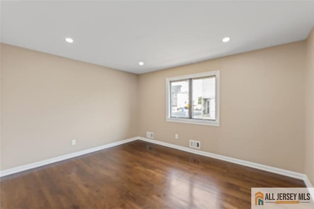 114 Holly St, Port Reading, NJ 07064 - empty room with wood finished floors and recessed lighting