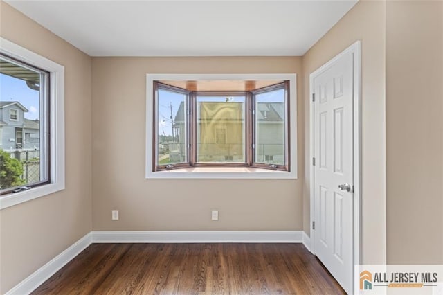 114 Holly St, Port Reading, NJ 07064 - unfurnished room with plenty of natural light and wood finished floors