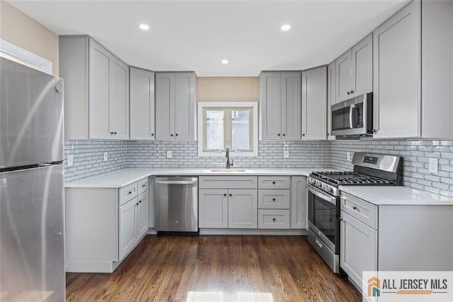 114 Holly St, Port Reading, NJ 07064 - kitchen with stainless steel appliances, gray cabinets, light countertops, decorative backsplash, and recessed lighting