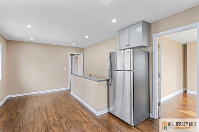 114 Holly St, Port Reading, NJ 07064 - kitchen with freestanding refrigerator, wood finished floors, and recessed lighting