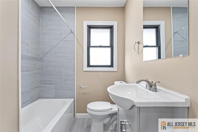 114 Holly St, Port Reading, NJ 07064 - full bathroom featuring vanity, plenty of natural light, and shower / tub combination
