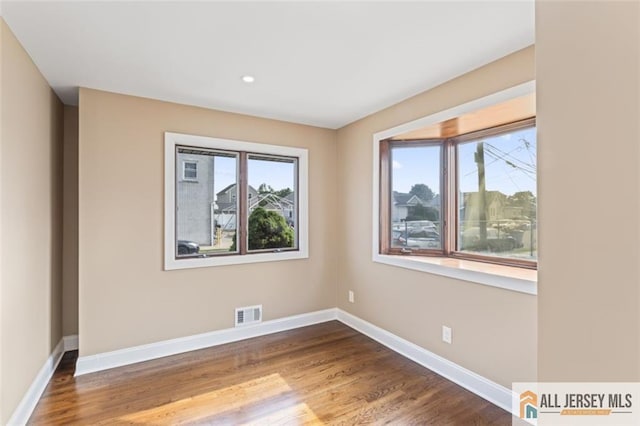 114 Holly St, Port Reading, NJ 07064 - spare room featuring wood finished floors and recessed lighting