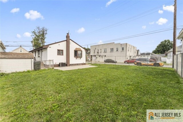 114 Holly St, Port Reading, NJ 07064 - rear view of property featuring a patio