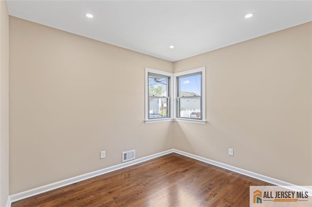114 Holly St, Port Reading, NJ 07064 - empty room with wood finished floors and recessed lighting
