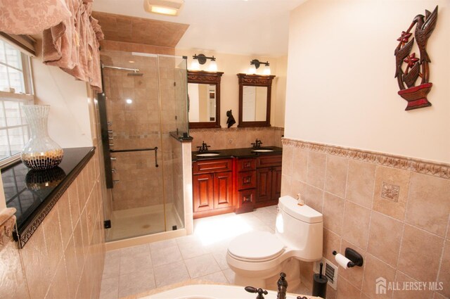 5 Dan Ct, Old Bridge, NJ 08857 - full bathroom with tile walls, a bidet, a shower stall, double vanity, and tile patterned flooring