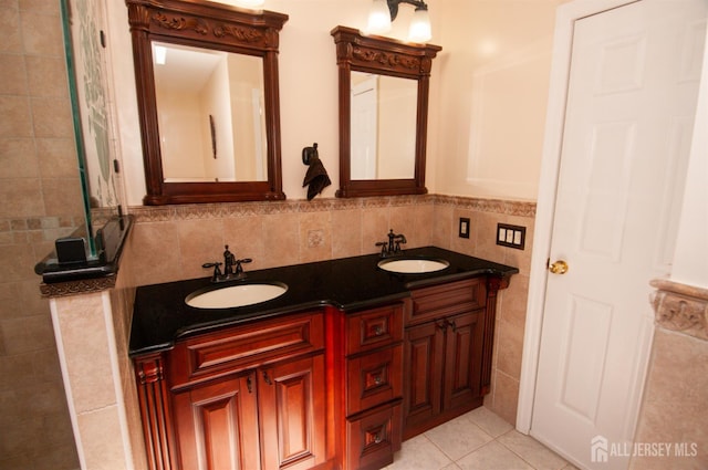 5 Dan Ct, Old Bridge, NJ 08857 - full bathroom with double vanity, tile walls, and tile patterned floors