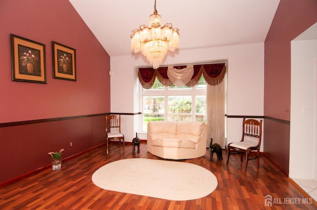 5 Dan Ct, Old Bridge, NJ 08857 - living area featuring a chandelier, wood finished floors, and vaulted ceiling