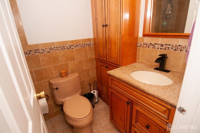5 Dan Ct, Old Bridge, NJ 08857 - bathroom with tile walls, vanity, tile patterned flooring, and wainscoting