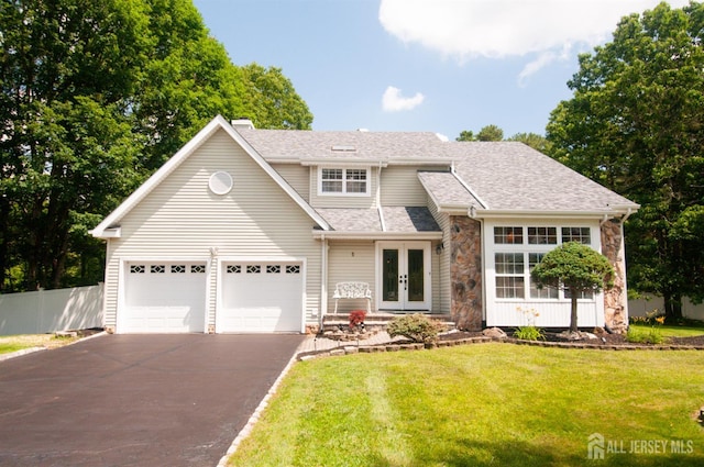 5 Dan Ct, Old Bridge, NJ 08857 - view of front facade featuring french doors, driveway, stone siding, a chimney, and a garage