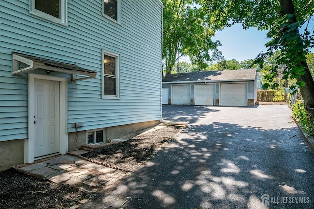 160 Academy St, South Orange Village, NJ 07079 - view of property exterior featuring a detached garage and an outbuilding