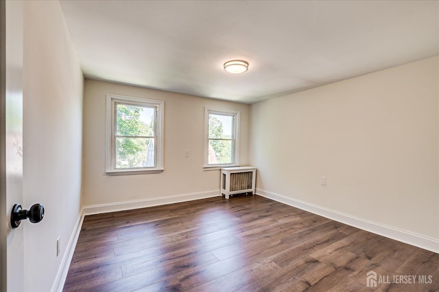 160 Academy St, South Orange Village, NJ 07079 - empty room with radiator and dark wood finished floors