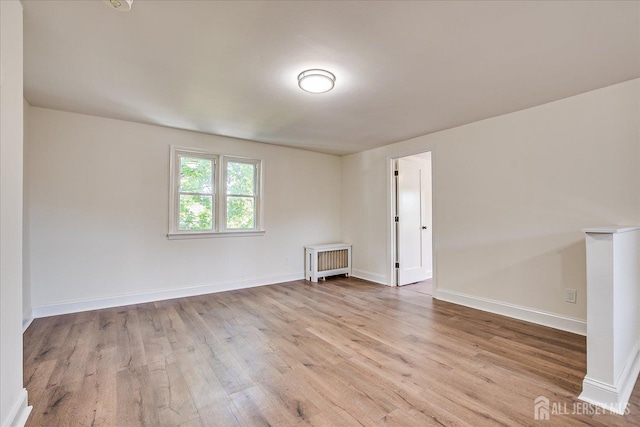 160 Academy St, South Orange Village, NJ 07079 - empty room with wood finished floors and radiator heating unit