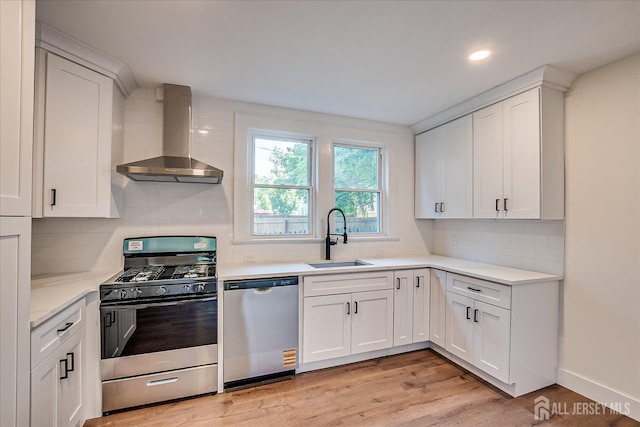 160 Academy St, South Orange Village, NJ 07079 - kitchen featuring appliances with stainless steel finishes, wall chimney exhaust hood, decorative backsplash, light countertops, and recessed lighting
