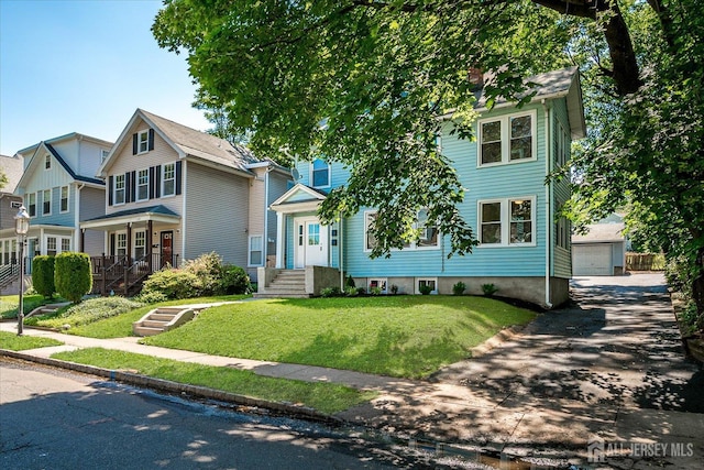 160 Academy St, South Orange Village, NJ 07079 - view of front of home with a front yard, an outdoor structure, and a detached garage