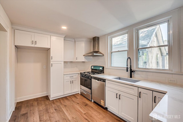 160 Academy St, South Orange Village, NJ 07079 - kitchen featuring wall chimney range hood, stainless steel appliances, light wood finished floors, white cabinets, and recessed lighting
